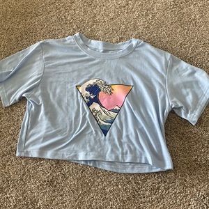 sunset wave design on blue cropped tee
